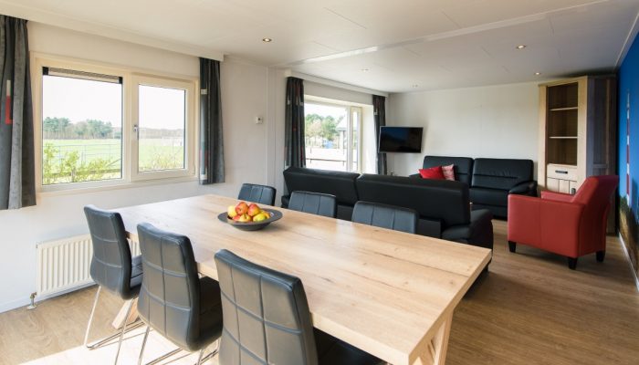 Chalet Plus 34 - woonkamer - Camping De Kiekduun